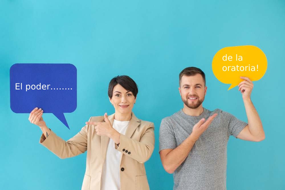 Pareja sosteniendo globos que dicen: El poder……..de la oratoria! 